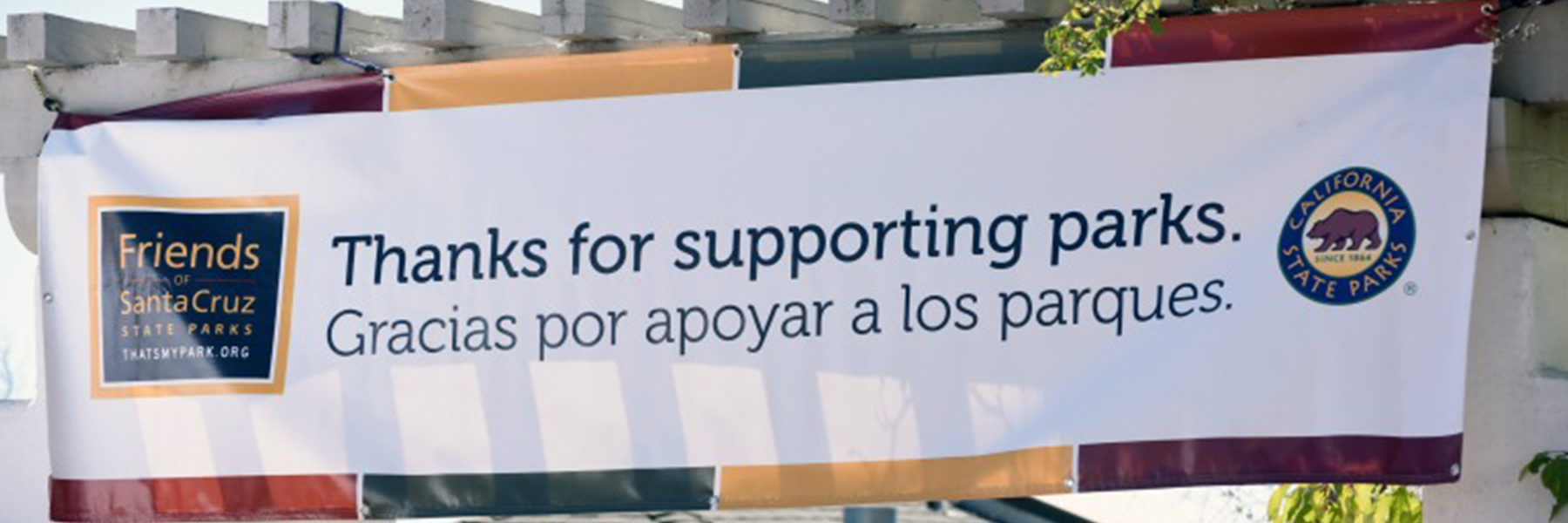 a banner that reads "Thanks for Supporting parks. Gracias for apoyar a los parques."