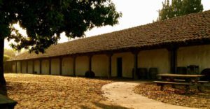 Side of the Santa Cruz Mission at sunrise