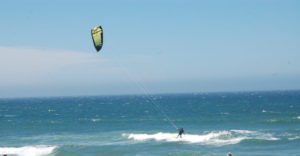 a kite surfer riding a wave at Rancho Del oso