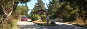 a car drives past a state park entry booth