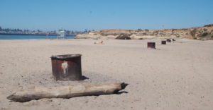 a line of bonfire pits at Seabright beach
