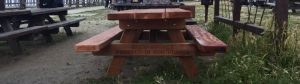 Buzz Gorsky tribute table, with the phrase "Buzz Gorsky forever in our hearts" etched on the bench