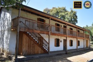 Castro Adobe entryway with wooden porch and stairs
