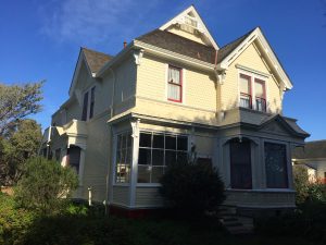 white wood paneled farm house