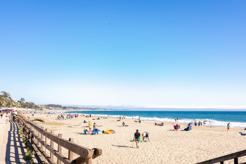 A busy beach on a sunny day