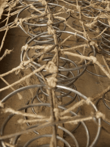 twine tangled in metal coils