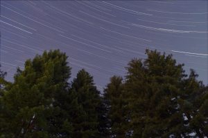 long exposure of the night sky, stars blurry as the Earth moves