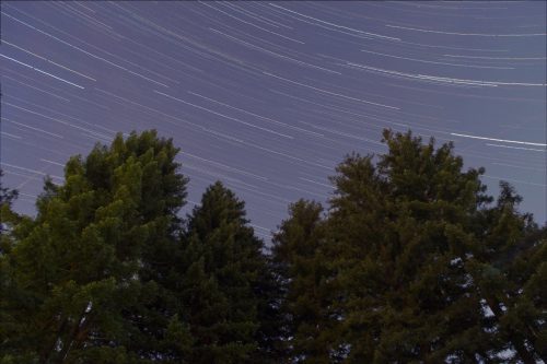 long exposure of the night sky, stars blurry as the Earth moves