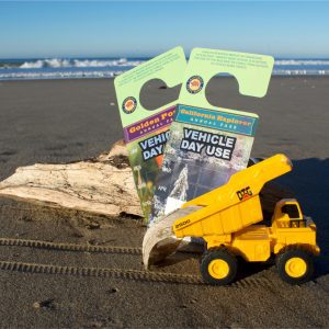 2024 Parks passes with a toy truck on a beach