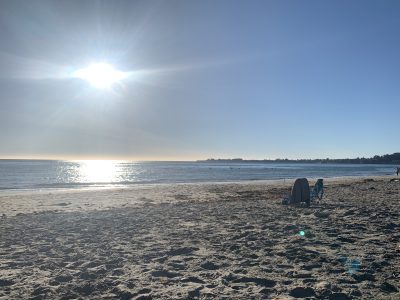 Sun shining high in the sky over seacliff state beach