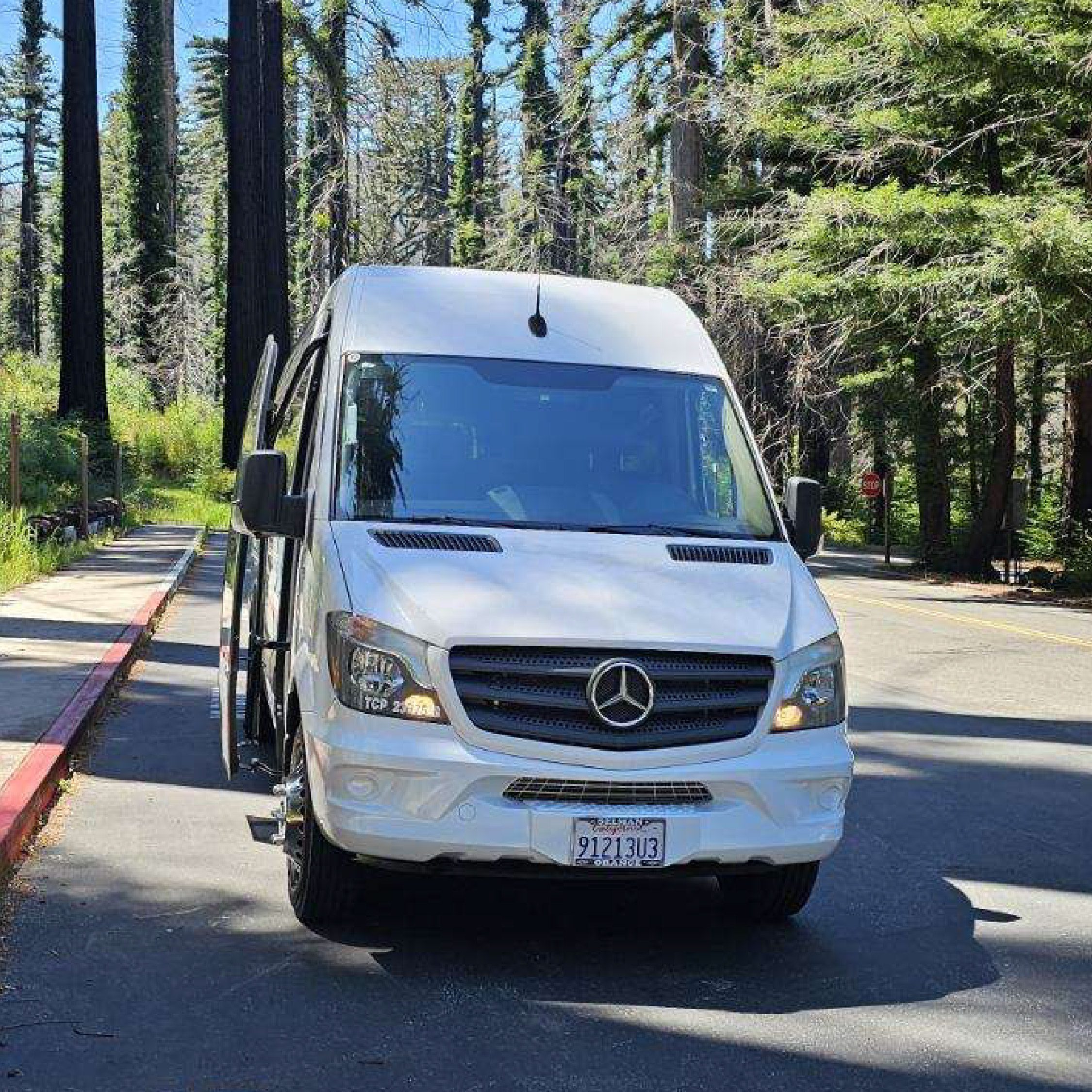 The Big Basin Shuttle Driving along a forest road